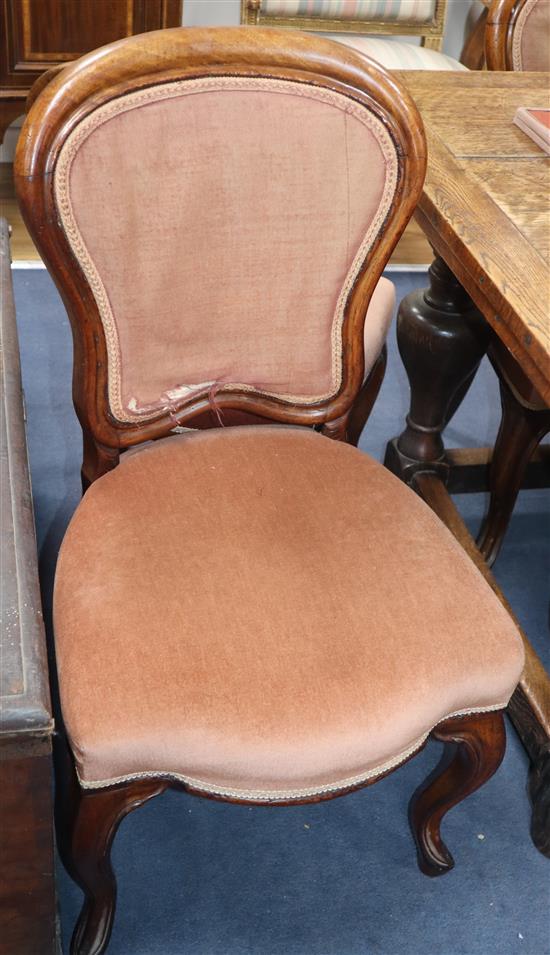 A set of six German walnut dining chairs